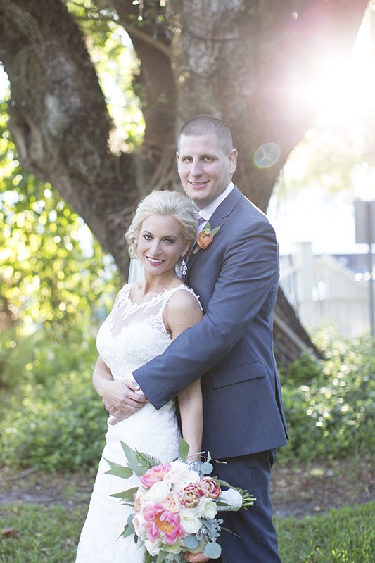 bride and groom lens flare