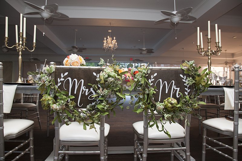 bride and grooms seat at reception