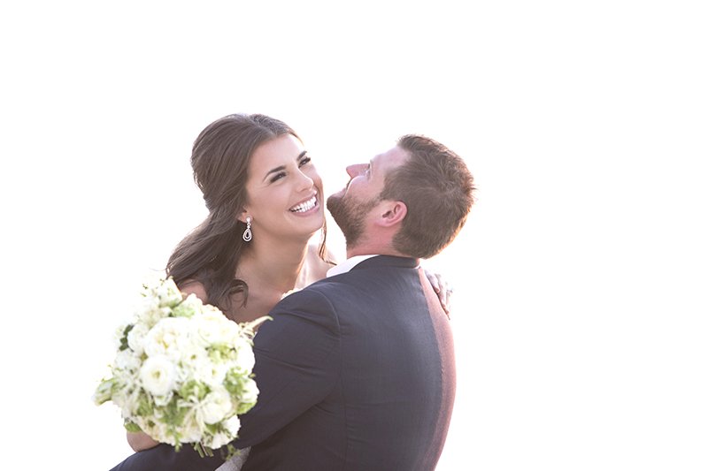 Fun and candid photo of bride and groom 
